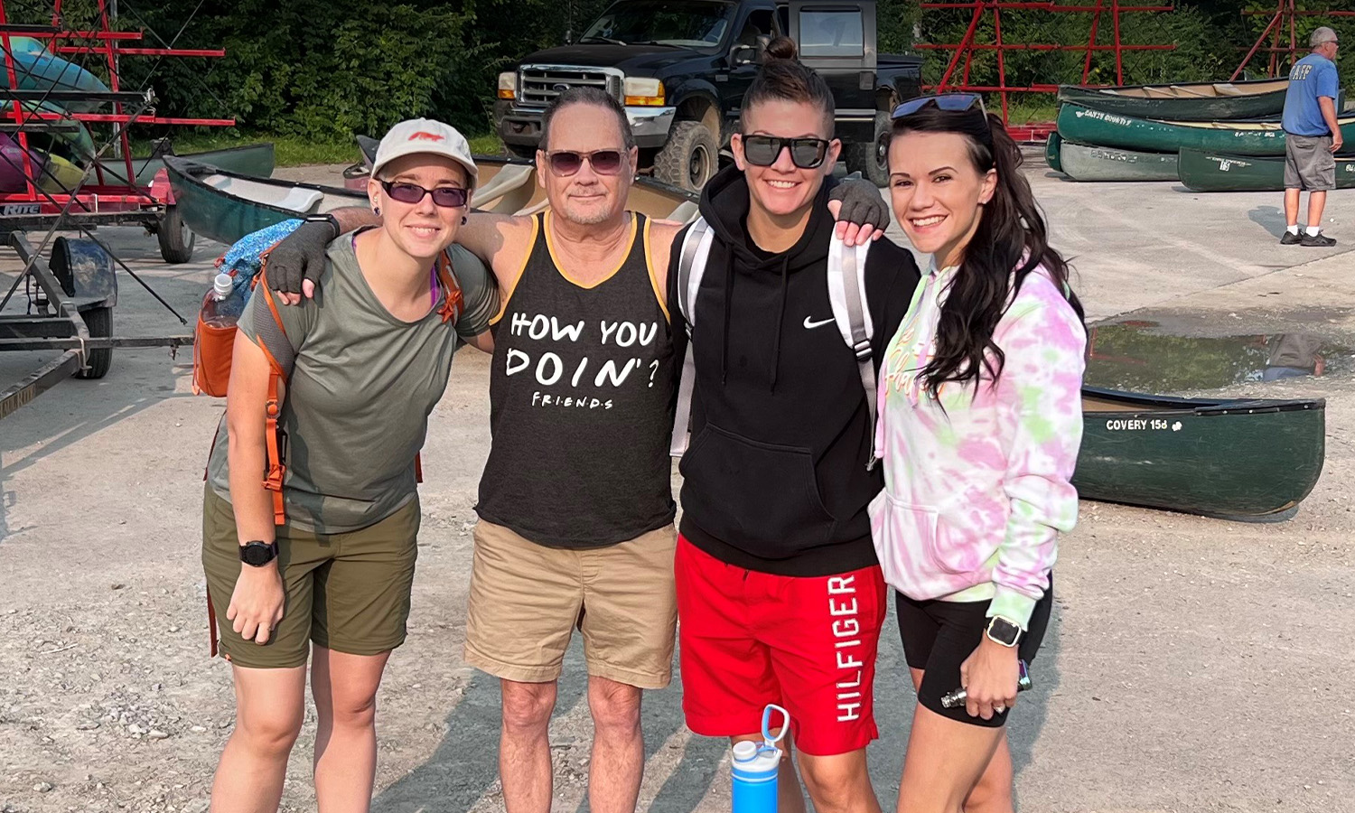 Warehouse Associate Andrea Joyner (left), Estimator Wynn Levi, Hand Bindery Team Lead Shaila Miller (right) and Shaila’s fiancée, Morgann Ancil, participated in a White River Cleanup Event in Indianapolis.